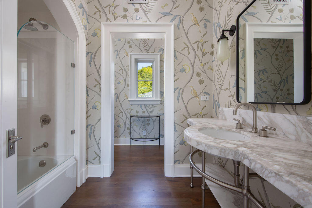 857 Picacho Lane Santa Barbara, CA 93108 - Photo 33 of 46 a bathroom with a granite countertop sink a mirror and a bathtub