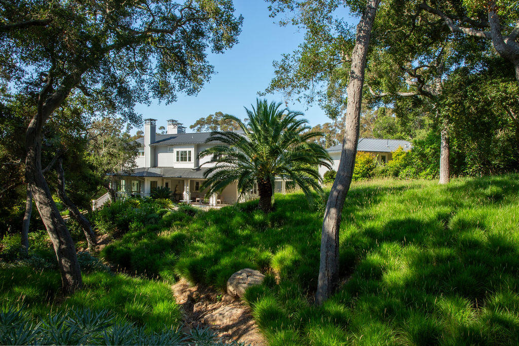 857 Picacho Lane Santa Barbara, CA 93108 - Photo 37 of 46 a view of a multi story yard with plants and large trees