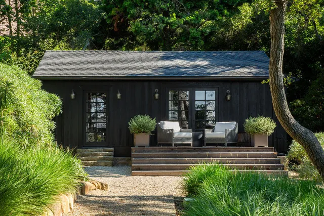 a view of house with backyard and seating space