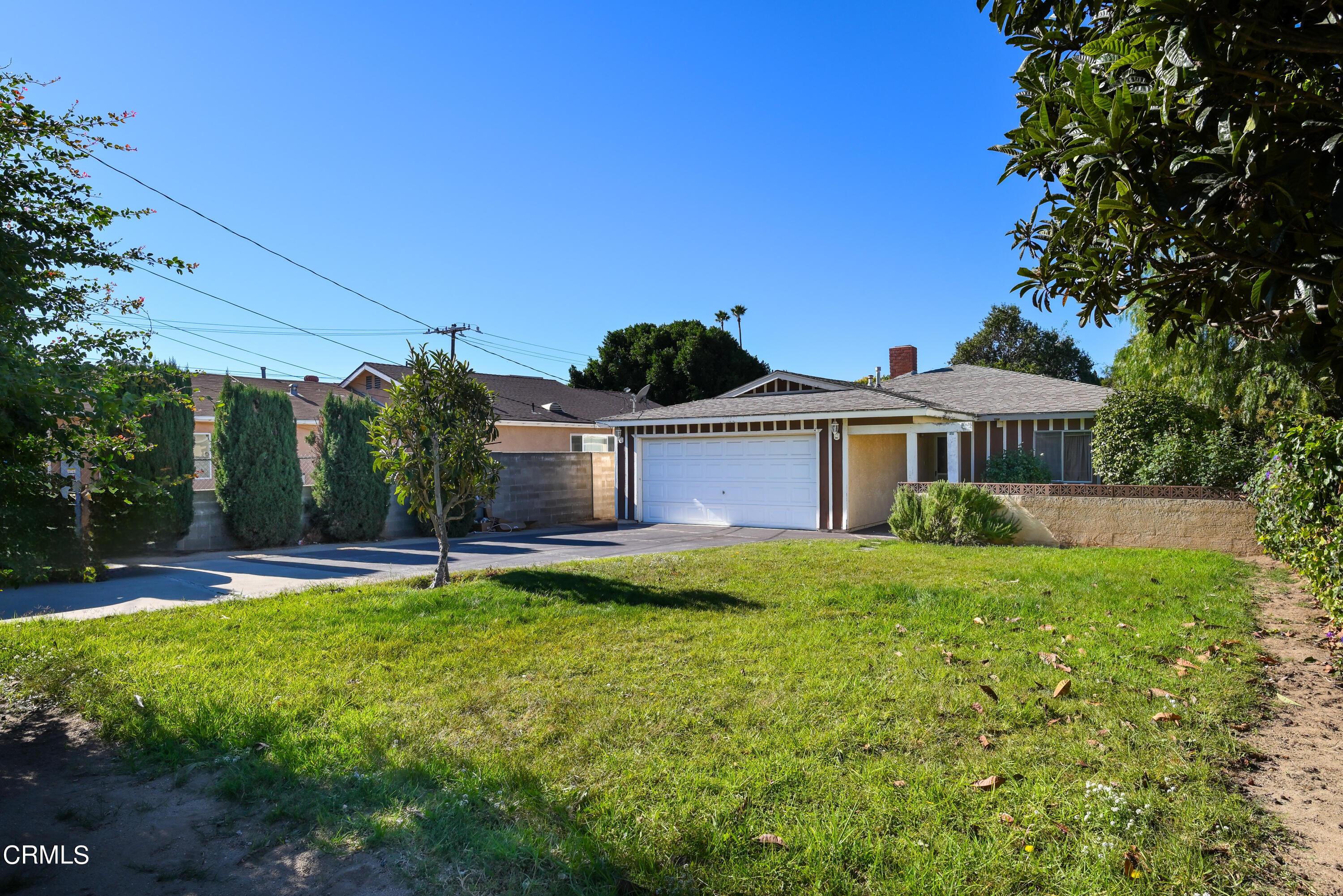 947 Walnut Canyon Road Moorpark, CA 93021 - Photo 1 of 18 a front view of a house with garden