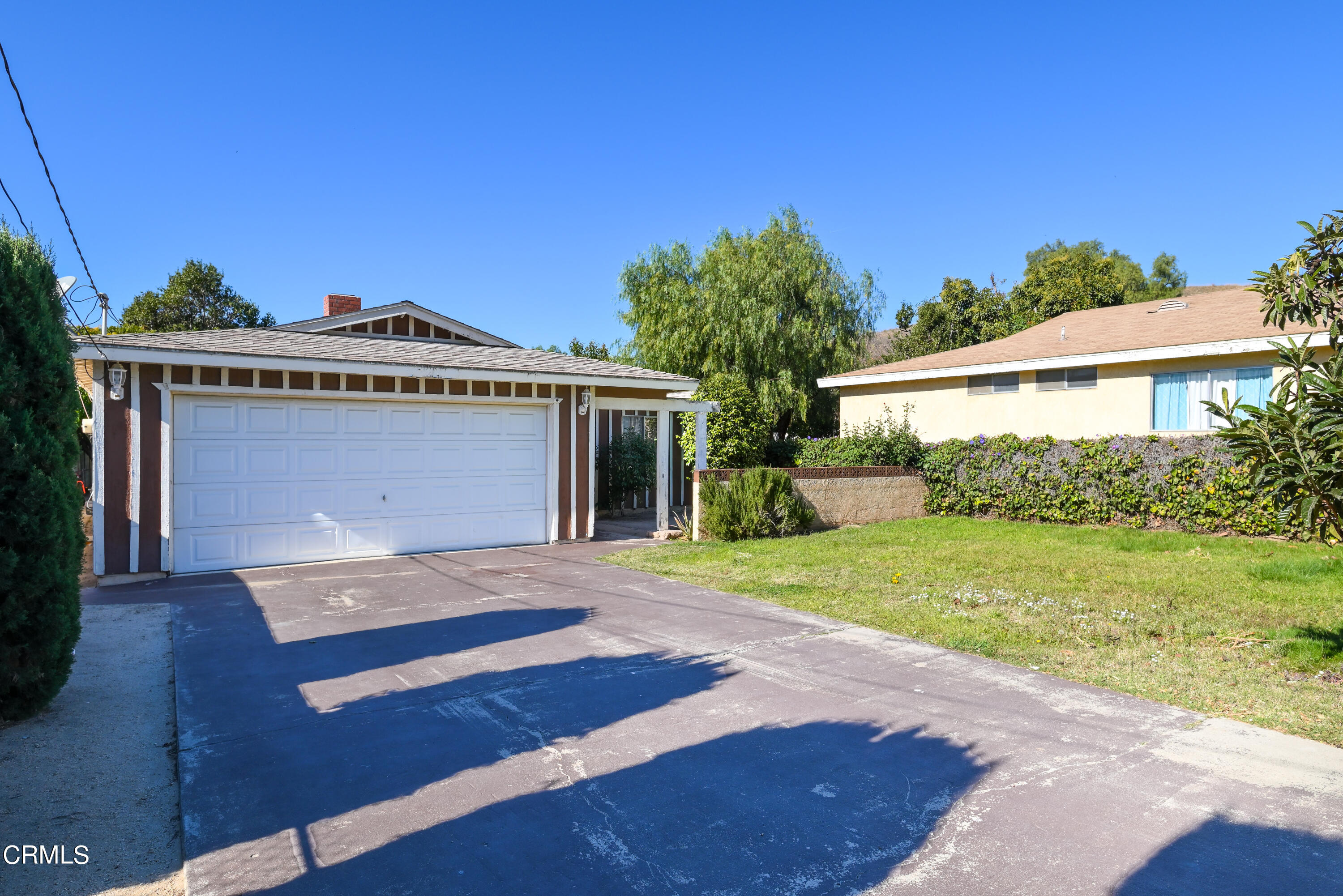 947 Walnut Canyon Road Moorpark, CA 93021 - Photo 17 of 18 a front view of a house with a yard