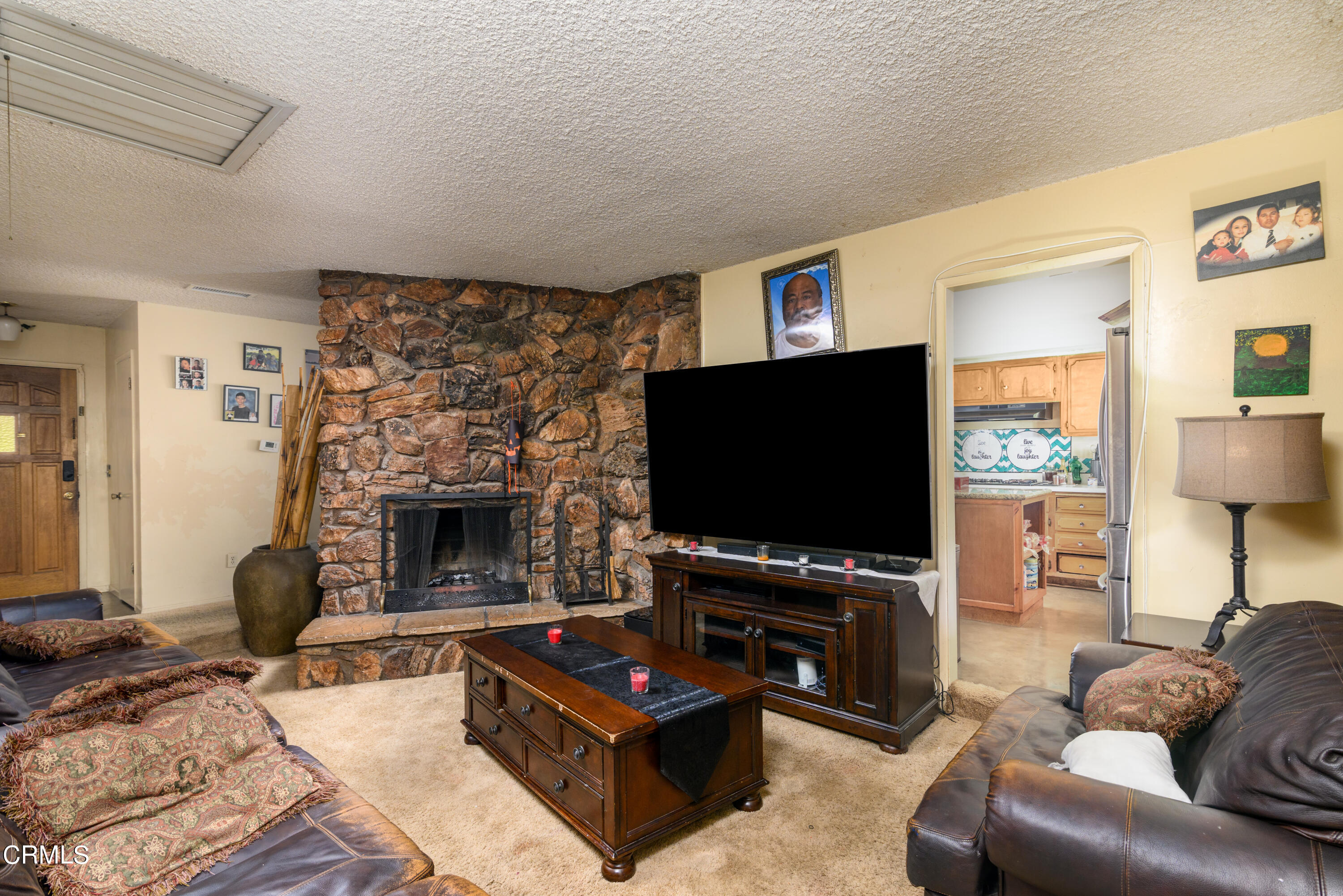 947 Walnut Canyon Road Moorpark, CA 93021 - Photo 3 of 18 a living room with furniture and a flat screen tv