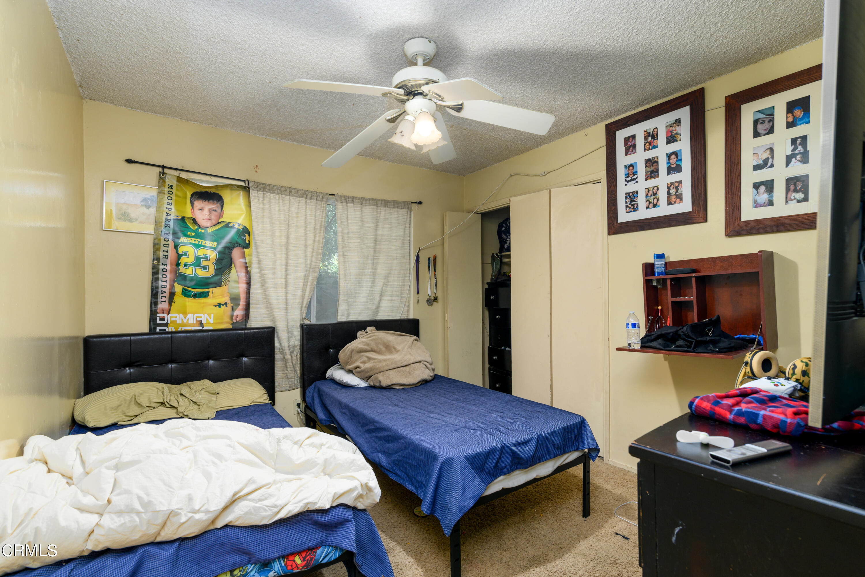 947 Walnut Canyon Road Moorpark, CA 93021 - Photo 7 of 18 a bedroom with a bed and a flat screen tv