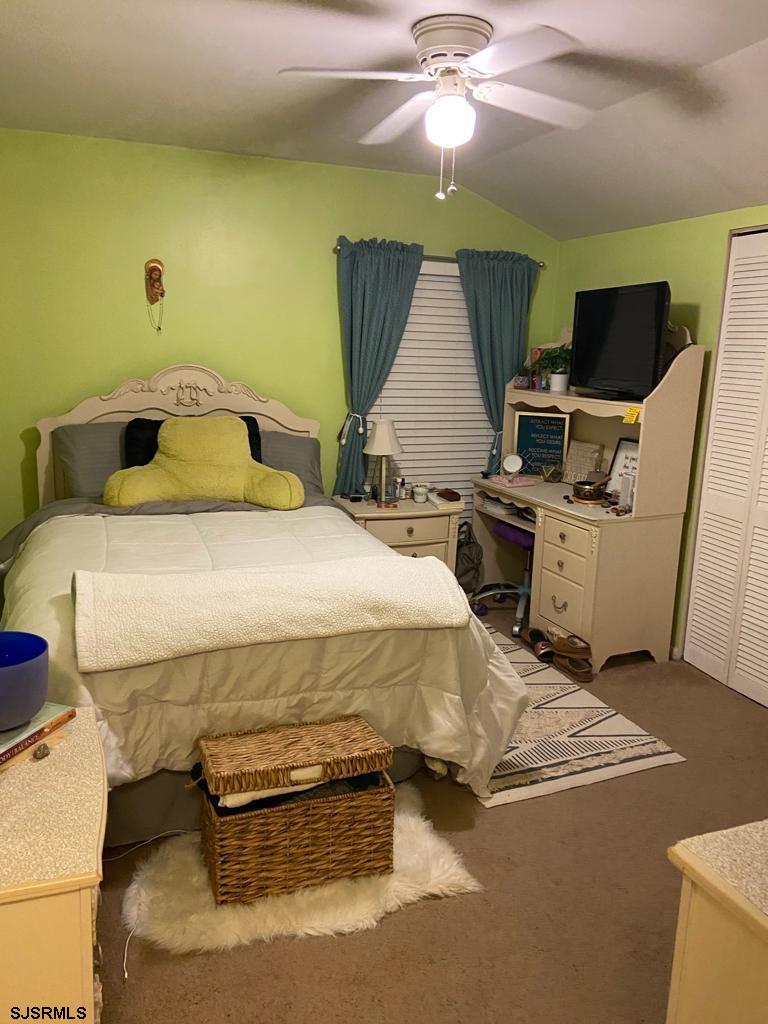 730 Warrena Road Atlantic City, NJ 08401 - Photo 11 of 17 a bedroom with a bed and furniture