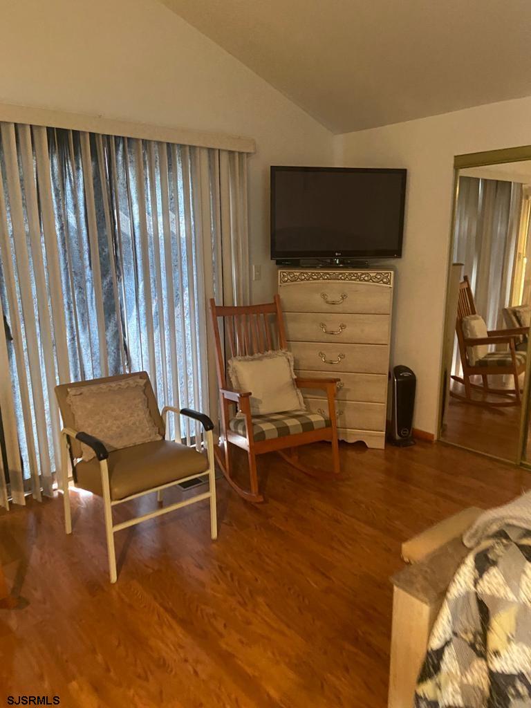 730 Warrena Road Atlantic City, NJ 08401 - Photo 12 of 17 a living room with furniture pool and flat screen tv