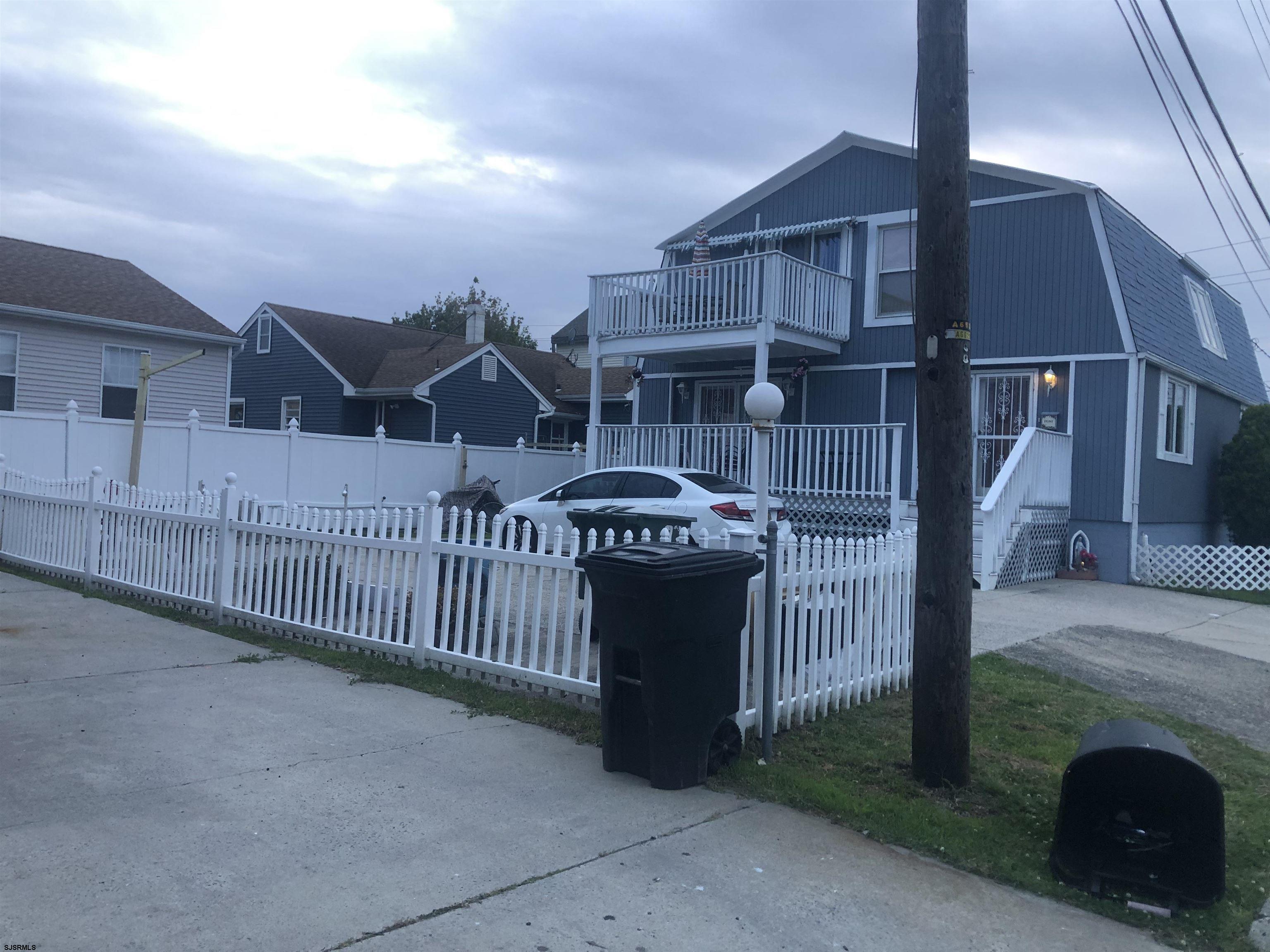 730 Warrena Road Atlantic City, NJ 08401 - Photo 16 of 17 a view of a house with wooden fence