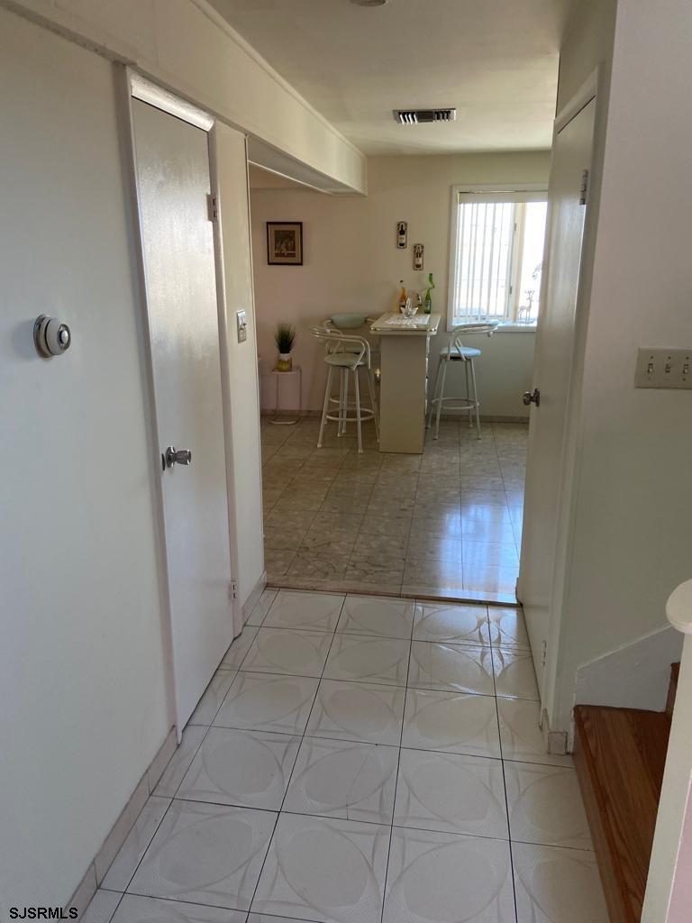730 Warrena Road Atlantic City, NJ 08401 - Photo 5 of 17 a view of a livingroom and a dining room with furniture