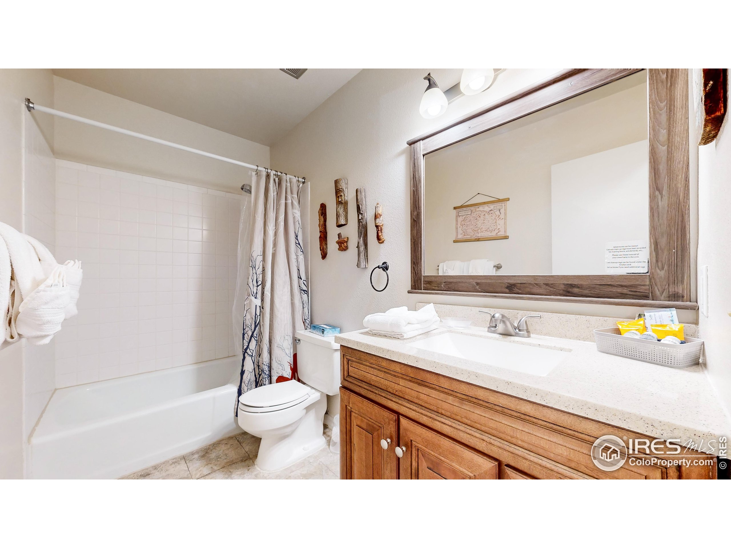 2760 Fall River Road, Unit 288 Estes Park, CO 80517 - Photo 14 of 32 a bathroom with a sink a toilet and shower