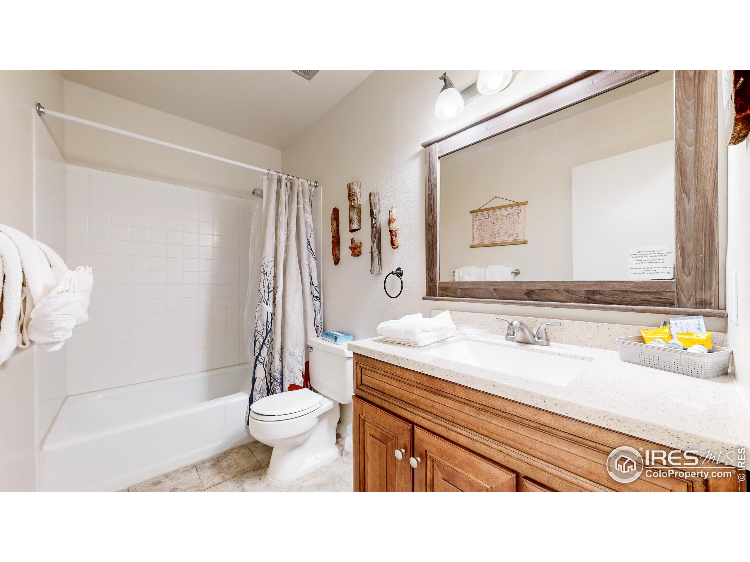 2760 Fall River Road, Unit 288 Estes Park, CO 80517 - Photo 15 of 32 a bathroom with a sink a toilet and shower