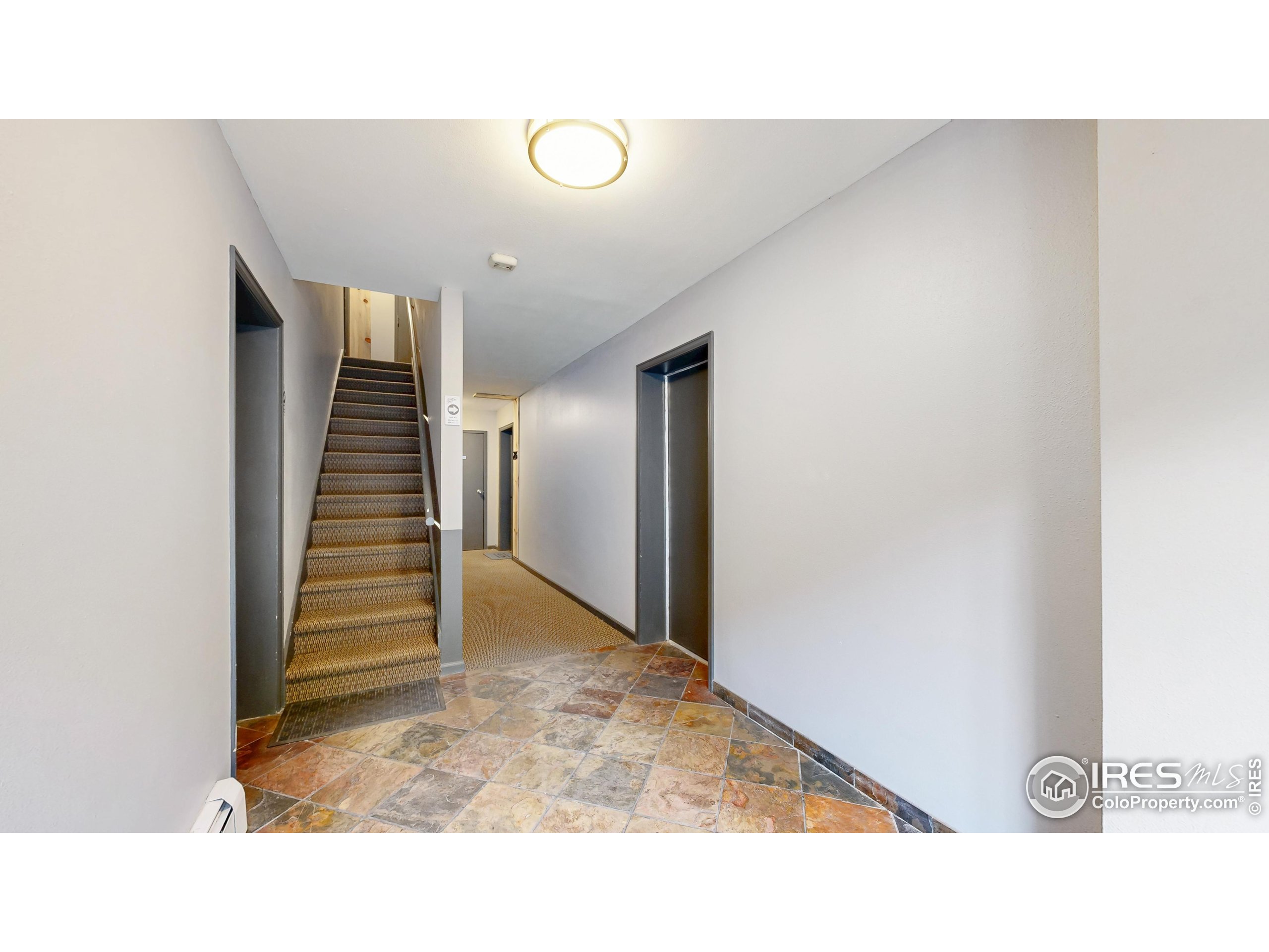 2760 Fall River Road, Unit 288 Estes Park, CO 80517 - Photo 16 of 32 a open hall with stairs