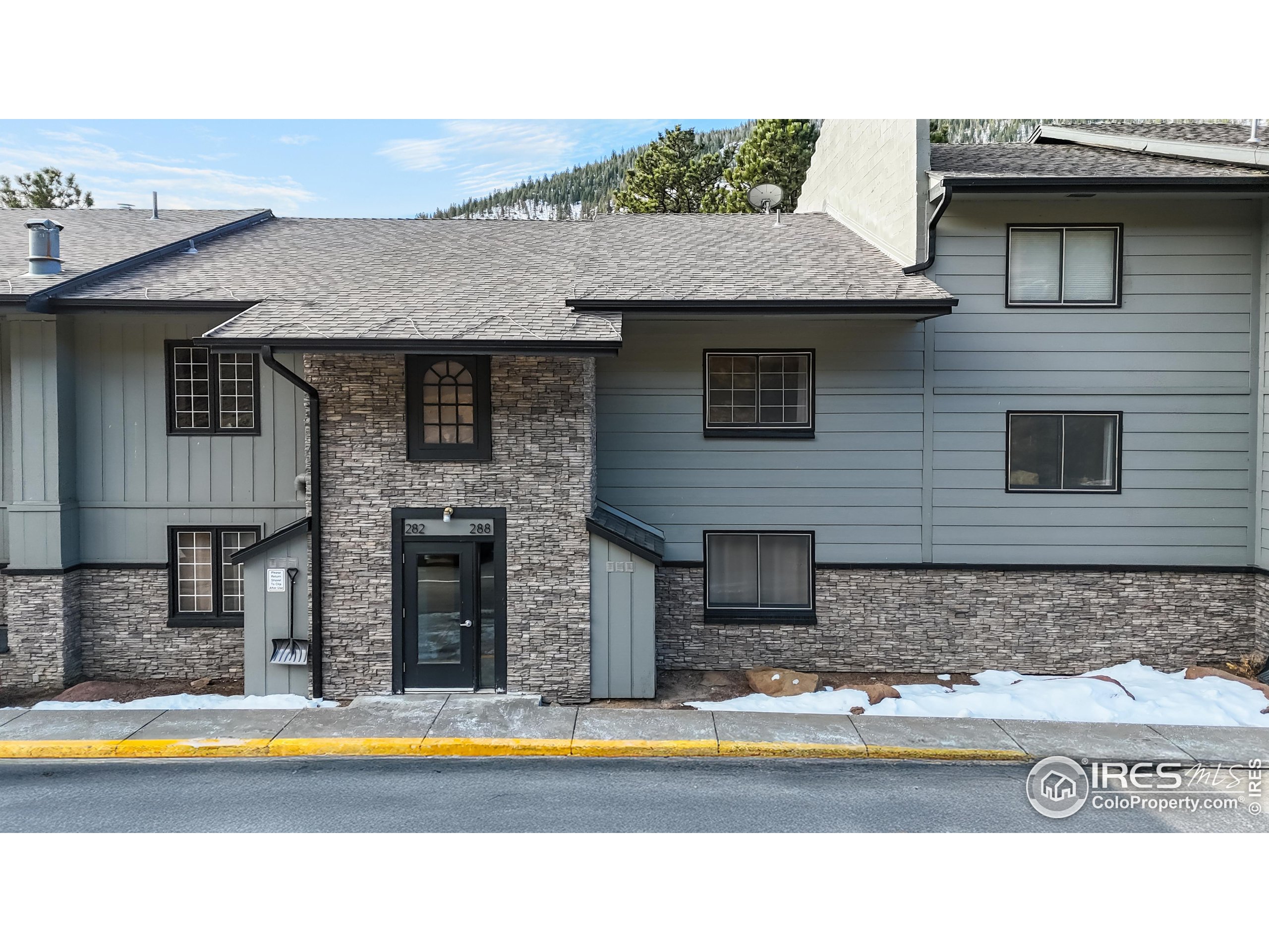 2760 Fall River Road, Unit 288 Estes Park, CO 80517 - Photo 27 of 32 a view of a house with swimming pool and sitting area