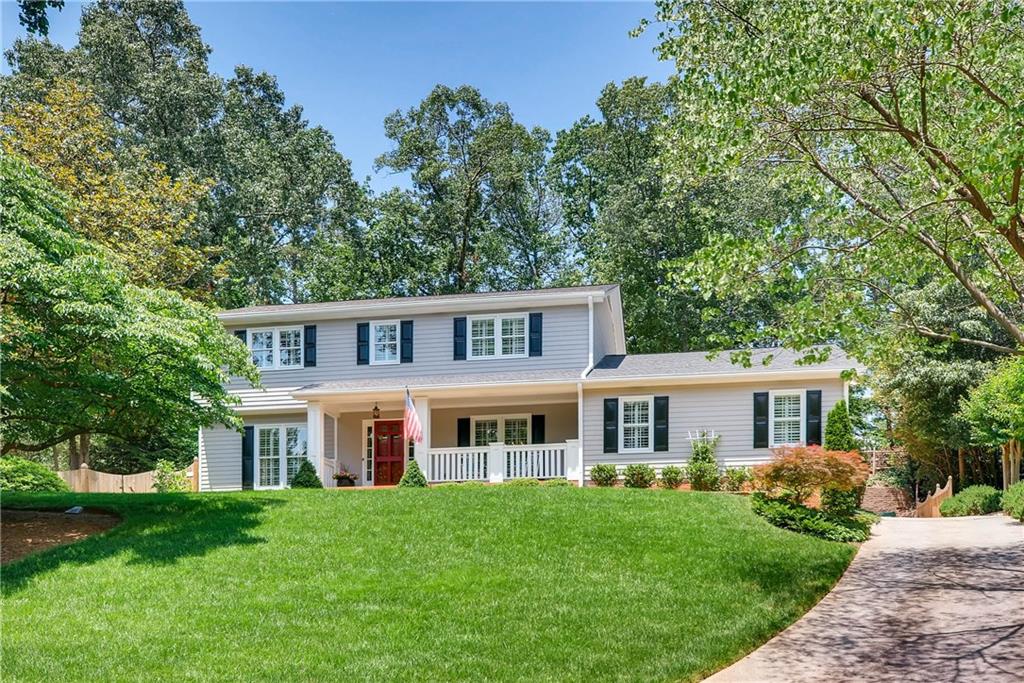Gorgeous traditional home is perfectly situated on this beautiful lot. Notice the gorgeous landscaping! 