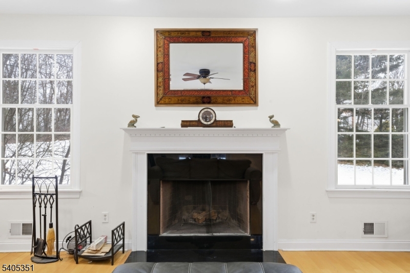 20 Sleepy Hollow Road Denville, NJ 07834 - Photo 12 of 48 a living room with furniture and a fireplace