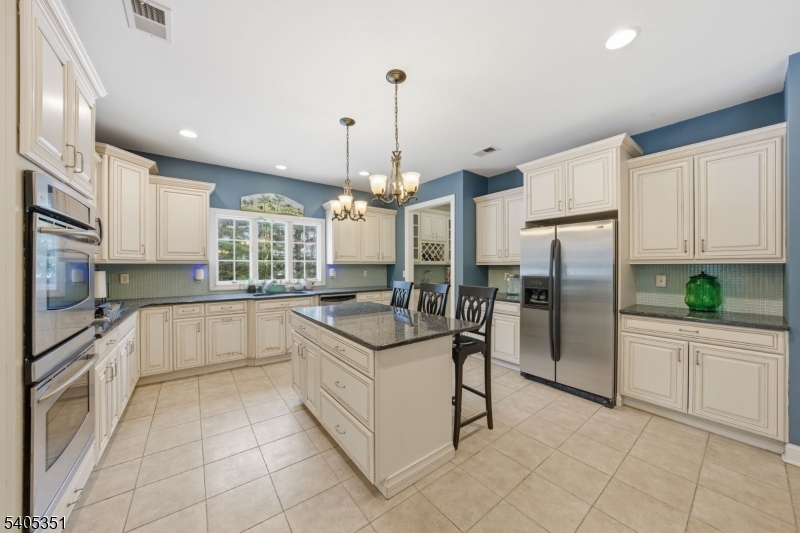 20 Sleepy Hollow Road Denville, NJ 07834 - Photo 13 of 48 a kitchen with stainless steel appliances granite countertop a sink and refrigerator