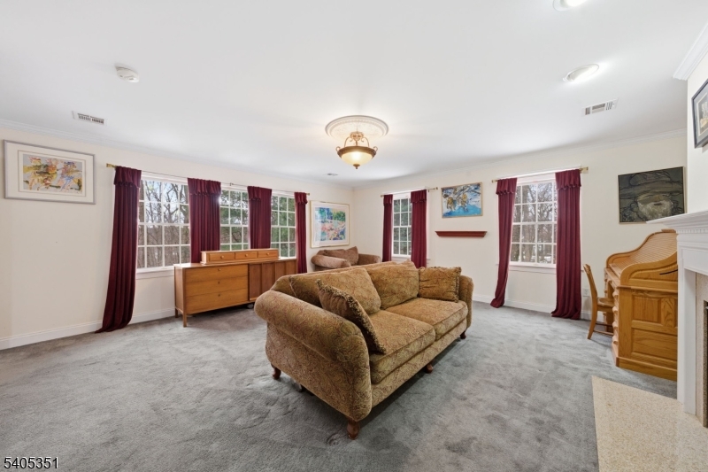 20 Sleepy Hollow Road Denville, NJ 07834 - Photo 27 of 48 a living room with furniture and a flat screen tv