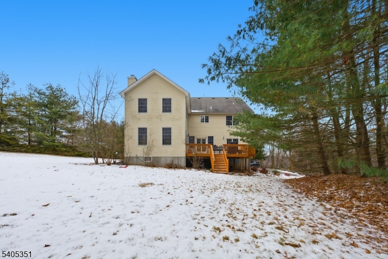 20 Sleepy Hollow Road Denville, NJ 07834 - Photo 41 of 48 a view of a house with a yard covered in snow