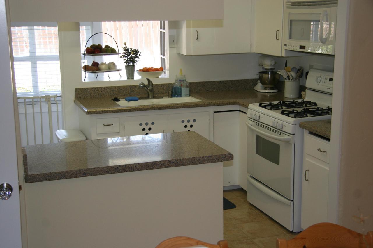 30 South Salinas Street, Unit D Santa Barbara, CA 93103 - Photo 11 of 19 a kitchen with stainless steel appliances granite countertop a sink stove and cabinets