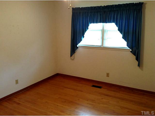 2405 Trawick Road Raleigh, NC 27604 - Photo 11 of 20 a view of an empty room with a window
