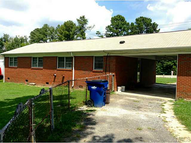 2405 Trawick Road Raleigh, NC 27604 - Photo 18 of 20 a view of a house with backyard and porch