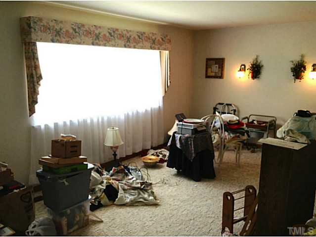2405 Trawick Road Raleigh, NC 27604 - Photo 5 of 20 a room with gym equipment and a large window