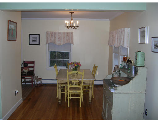 59 Pilgrim Road Marblehead, MA 01945 - Photo 5 of 11 a dining room with furniture and wooden floor