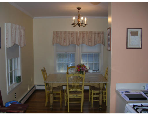 59 Pilgrim Road Marblehead, MA 01945 - Photo 6 of 11 a view of a dining room with furniture and chandelier