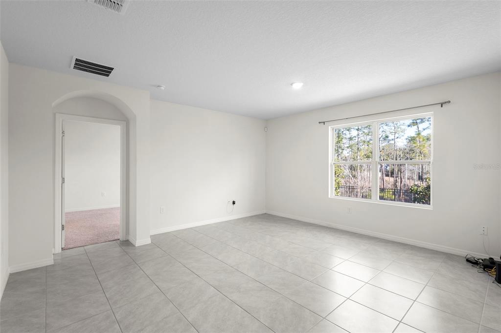 336 Camilla Road DeLand, FL 32724 - Photo 26 of 38 a view of an empty room with a window