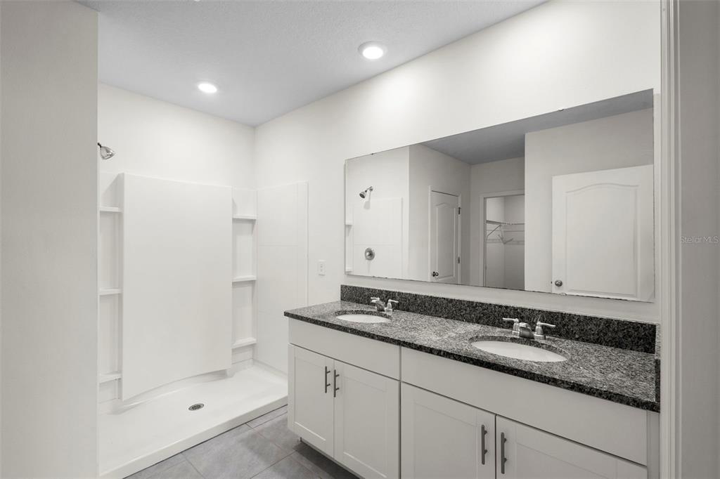 336 Camilla Road DeLand, FL 32724 - Photo 29 of 38 a bathroom with a sink and a mirror with shower