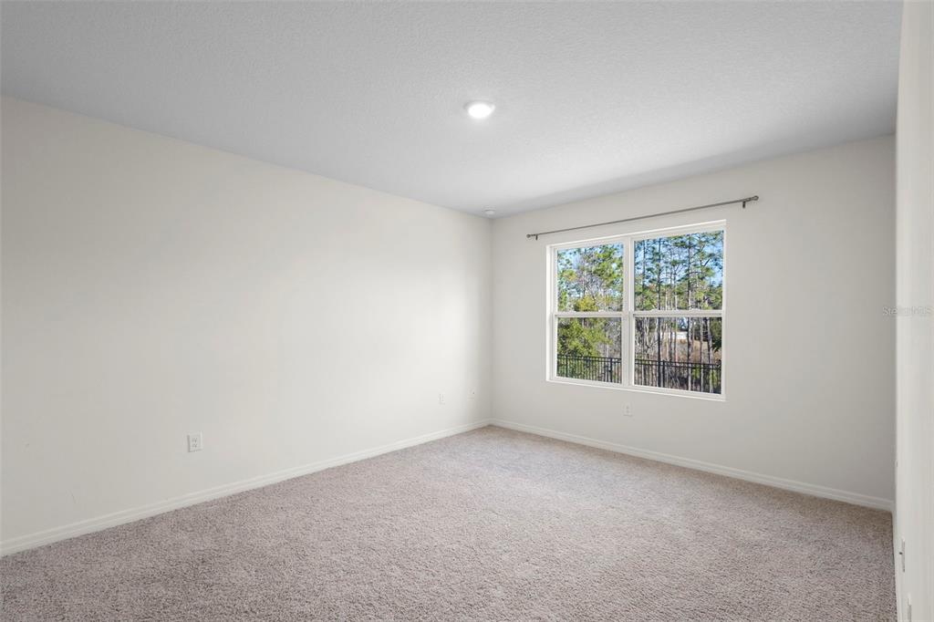 336 Camilla Road DeLand, FL 32724 - Photo 31 of 38 an empty room with windows
