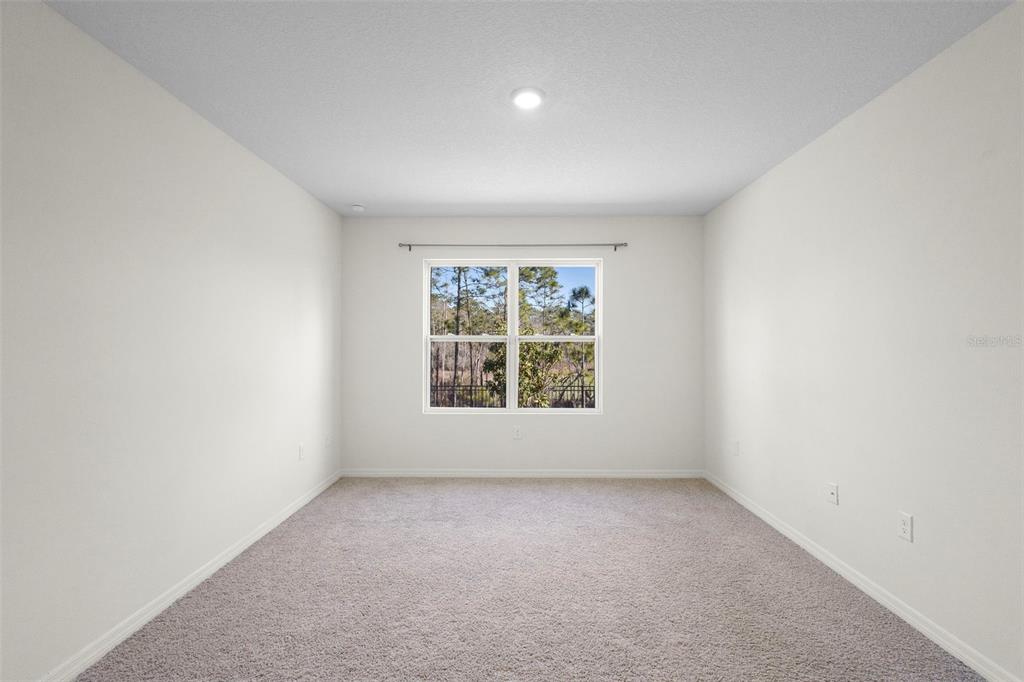 336 Camilla Road DeLand, FL 32724 - Photo 32 of 38 an empty room with a window