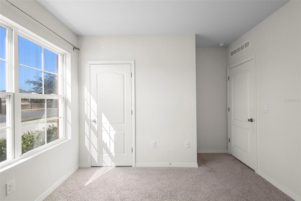 336 Camilla Road DeLand, FL 32724 - Photo 5 of 38 an empty room with windows