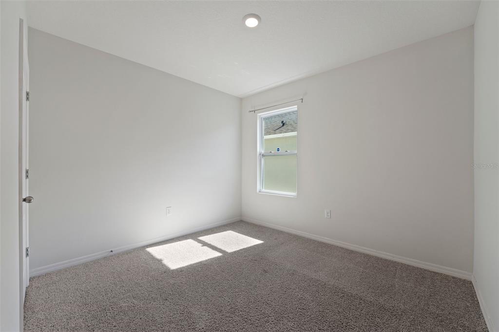336 Camilla Road DeLand, FL 32724 - Photo 7 of 38 an empty room with a window