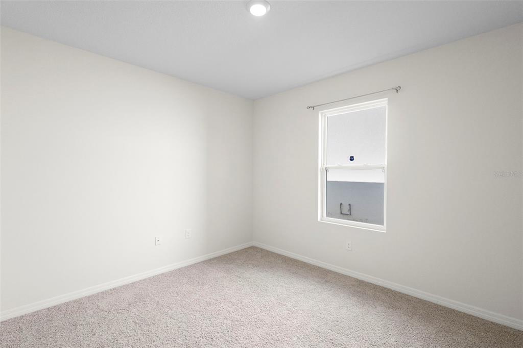 336 Camilla Road DeLand, FL 32724 - Photo 10 of 38 a view of an empty room and a window