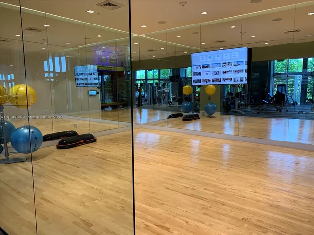 a room with lots of counter and chairs