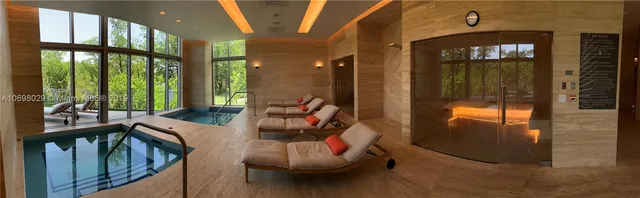 a dining room with furniture and a fireplace