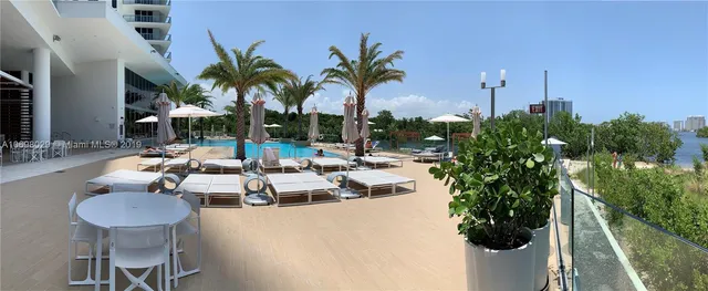 swimming pool view with a outdoor seating space