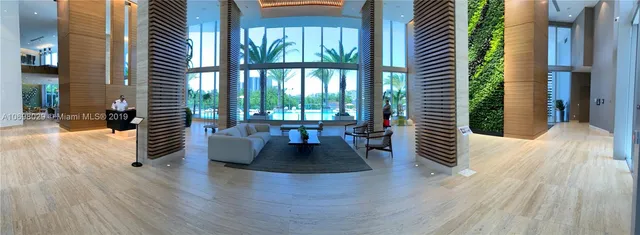 a view of livingroom with furniture and floor to ceiling window