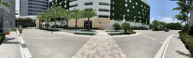a building with palm trees in front of it