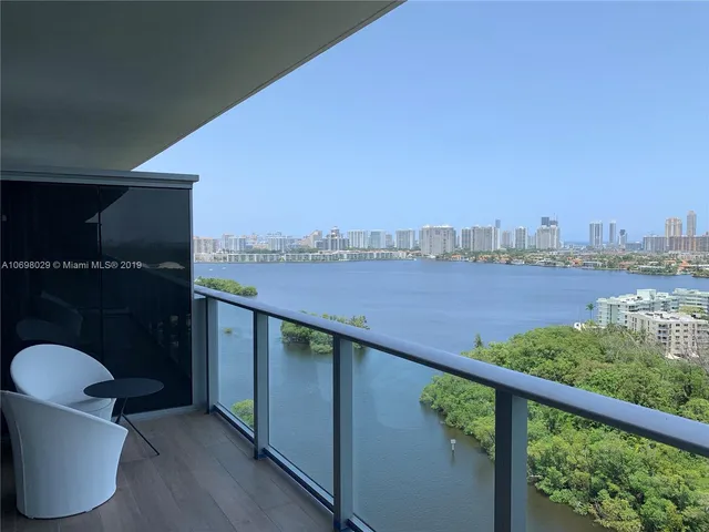 a view of a chair and table in the balcony
