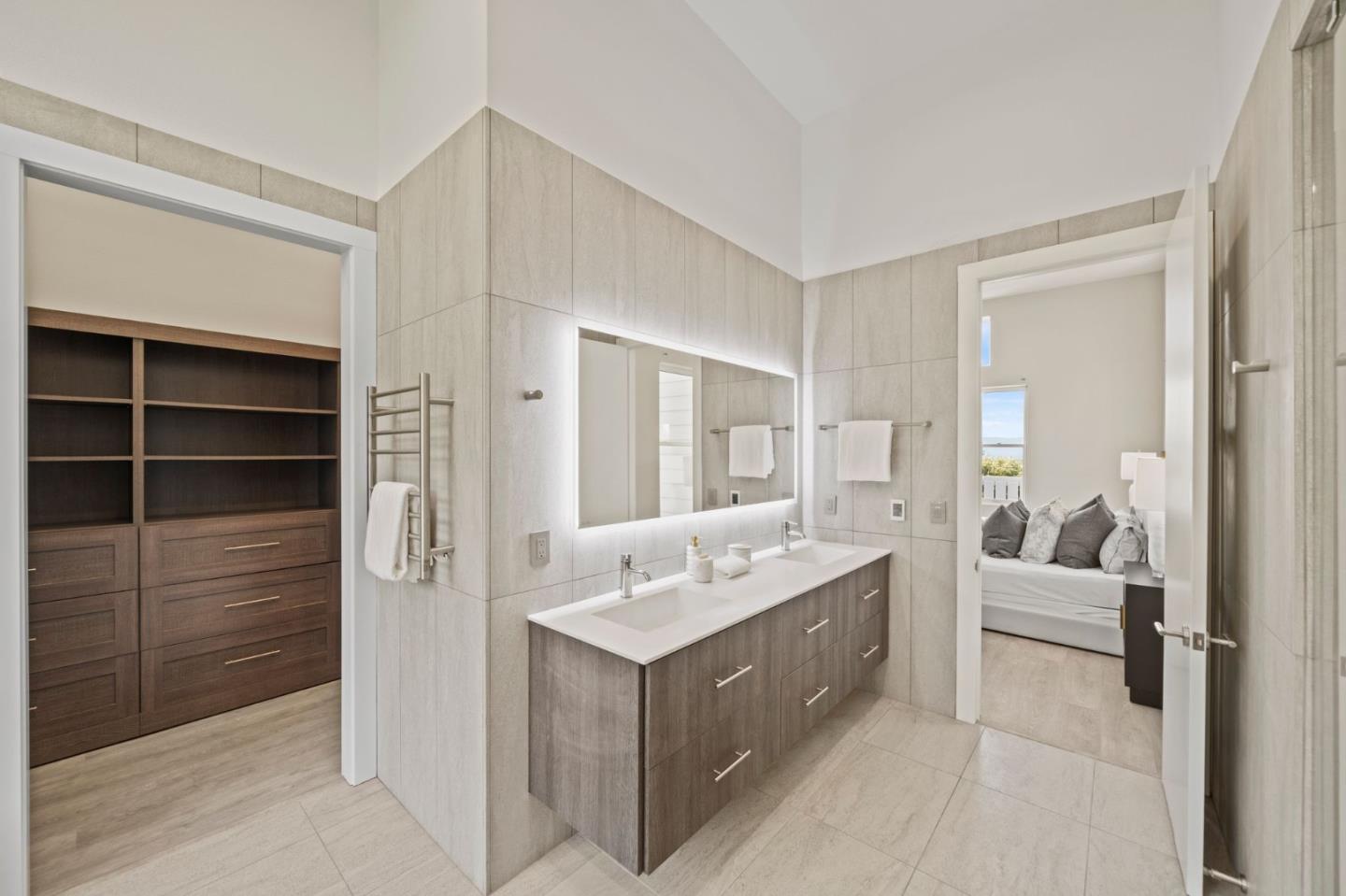 2698 Greenrock Road Milpitas, CA 95035 - Photo 37 of 99 a en suite bathroom with a double vanity sink a mirror and a shower