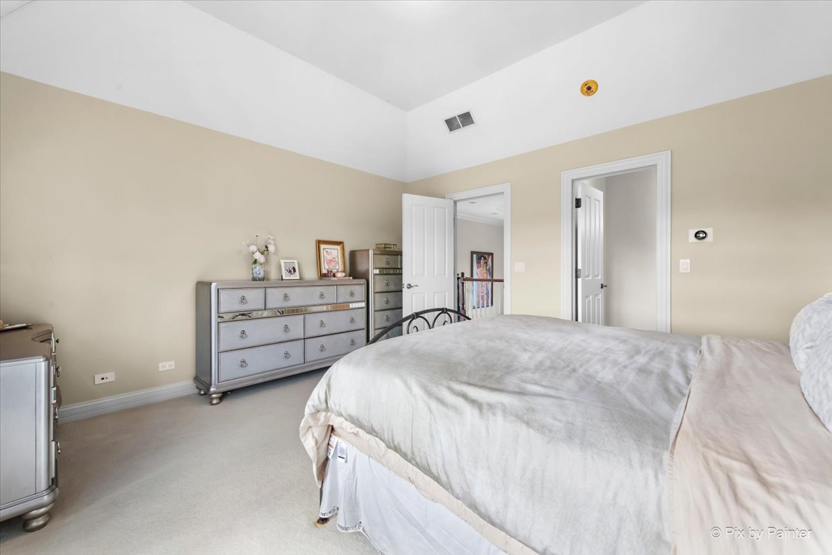 36W535 Hunters Gate Road St. Charles, IL 60175 - Photo 36 of 56 a bedroom with a bed and a cabinets
