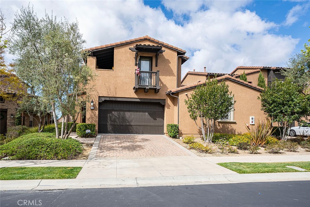 21 Chianti Ladera Ranch, CA 92694 - Photo 1 of 1 a front view of a house with a garden