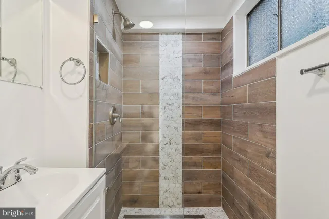 a bathroom with a sink and a shower