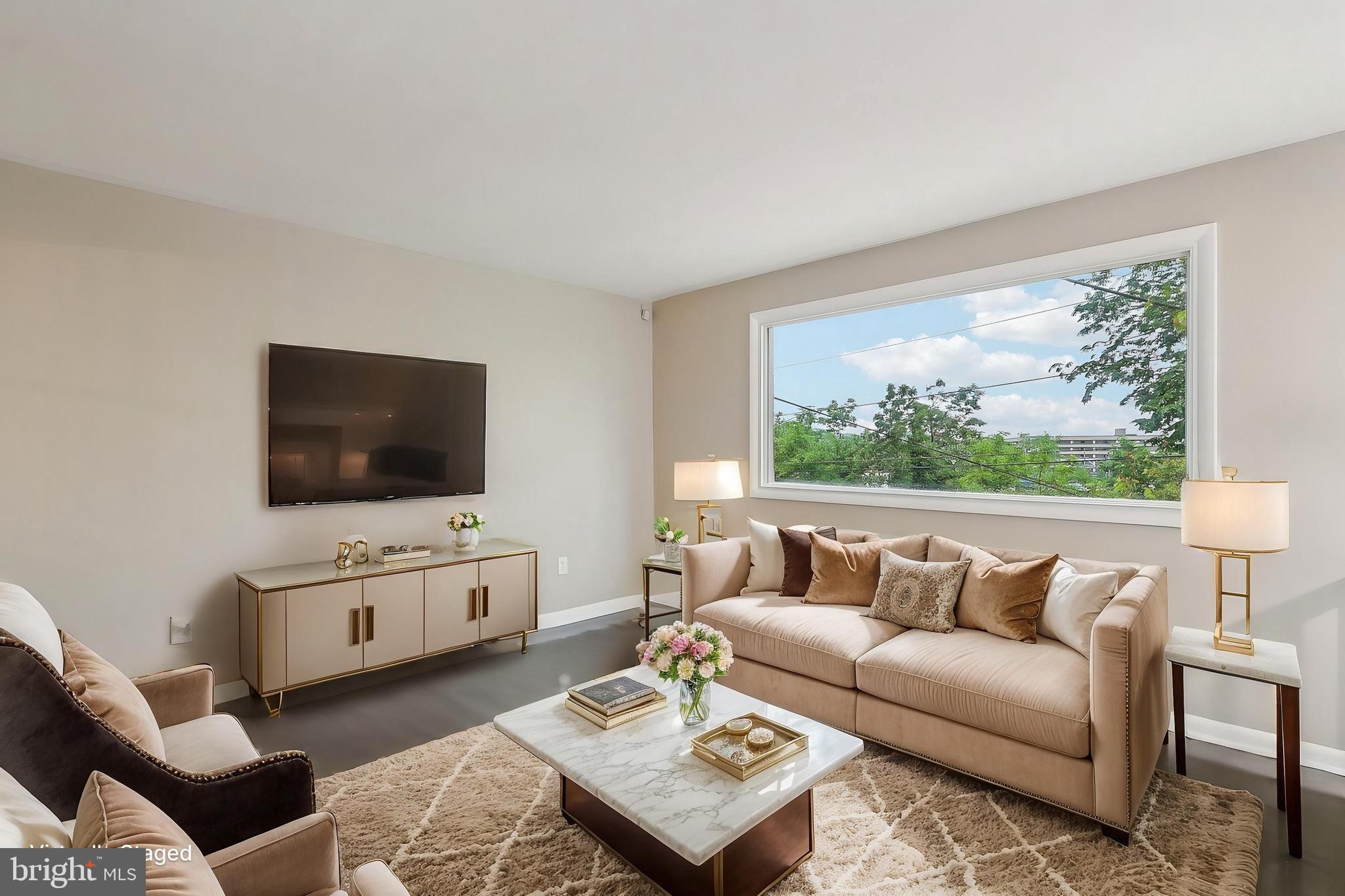 1360 W Street Northeast Washington, DC 20018 - Photo 5 of 48 a living room with furniture and a flat screen tv