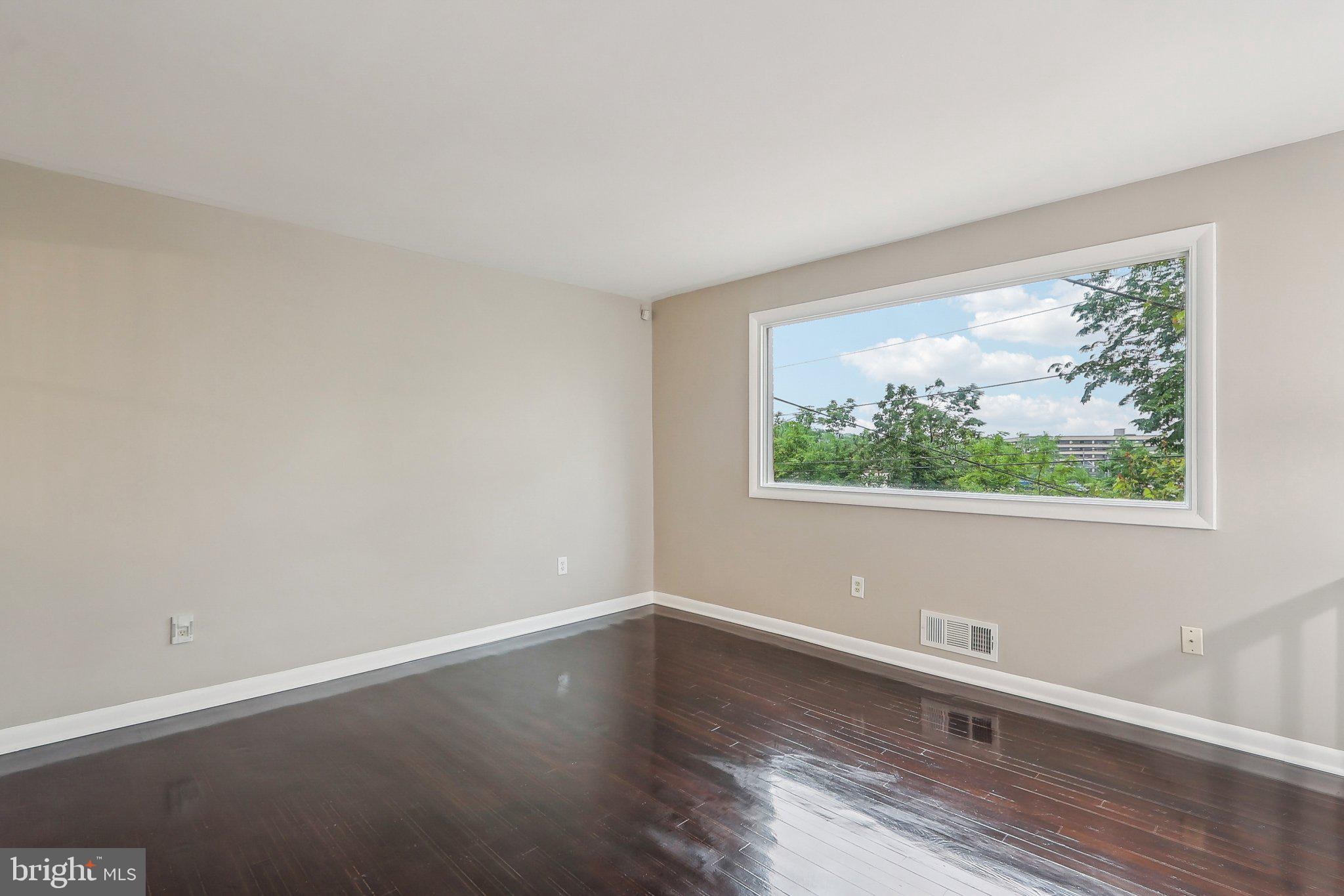 1360 W Street Northeast Washington, DC 20018 - Photo 6 of 48 a view of a small space with wooden floor and a window