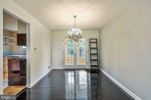 a view of an entryway with wooden floor and door