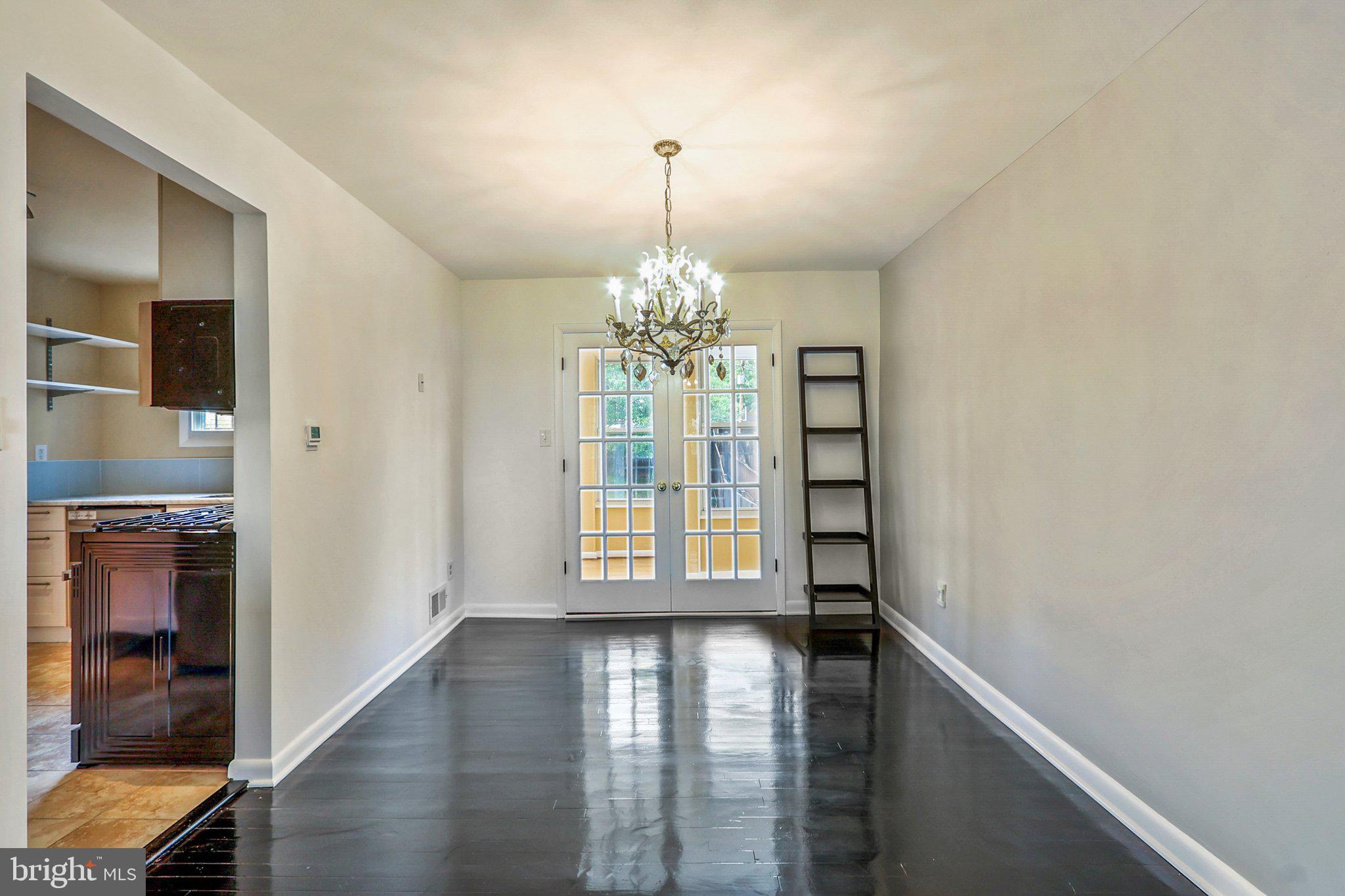 1360 W Street Northeast Washington, DC 20018 - Photo 9 of 48 a view of an entryway with wooden floor and door