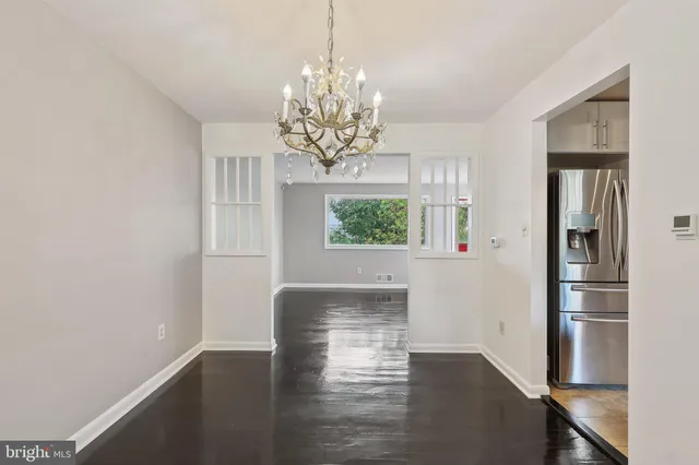 a view of kitchen with livingroom and window