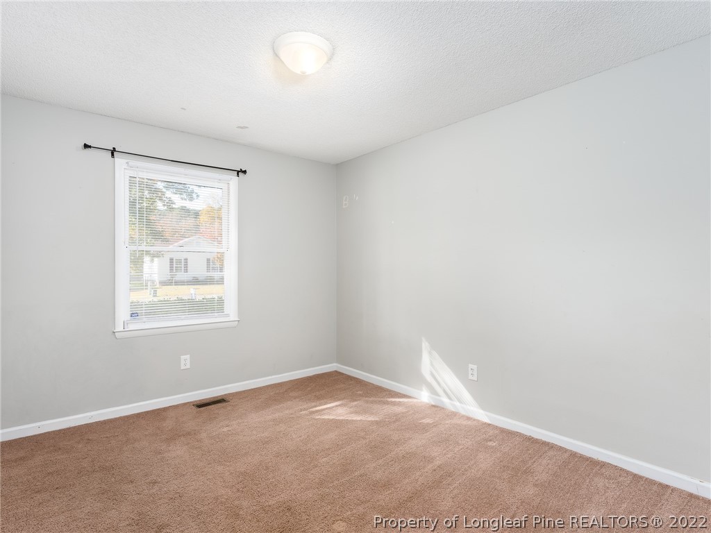921 Hollydale Lane Fayetteville, NC 28314 - Photo 22 of 32 an empty room with a window