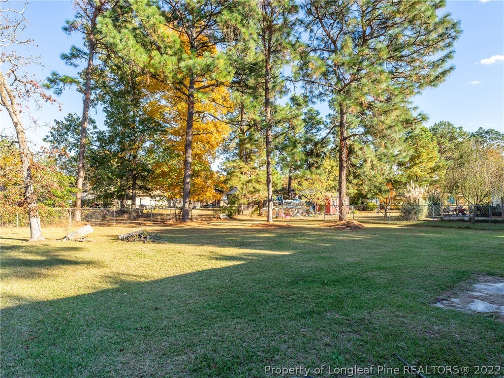 921 Hollydale Lane Fayetteville, NC 28314 - Photo 30 of 32 a view of swimming pool with an outdoor space and seating area